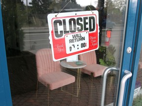 A Closed sign is taped to the door of a salon in Kensington. Stats show that Canada has lost nearly 2million jobs due to the COVID-19 pandemic. Friday, May 8, 2020. Dean Pilling/Postmedia