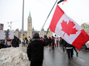 Freedom Convoy protesters gather on Wellington Street near the Parliament buildings in Ottawa, February 9, 2022.