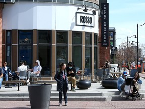 FILE PHOTO: People are seen walking during a warm afternoon in front of Rosso Coffee Roasters in Inglewood. Friday, April 30, 2021.