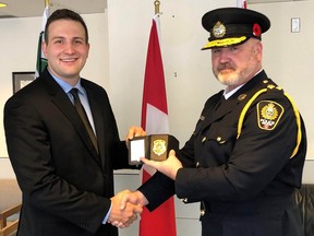 Constable Mathieu Nolet with Chief Donovan Fisher of the Nelson Police Department in November 2021. Mathieu Nolet remains in critical condition in hospital after being caught in an avalanche near Kaslo, BC.  Photo provided by the City of Nelson