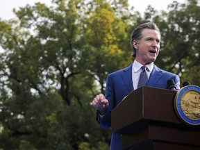 FILE – California Gov. Gavin Newsom delivers a speech after taking the oath of office on Friday, Jan. 6, 2023, outside the California state Capitol in Sacramento, Calf. On Tuesday, Jan. 10, Newsom will reveal his plan to cover what is expected to be a multi-billion dollar budget deficit.