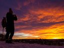 Calgarians enjoy a spectacular sunrise from the ridge in Renfrew on Thursday, December 8, 2022. 