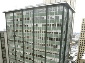 Pictured is the top portion of Elveden House, Calgary's first skyscraper which was completed in 1960. It is one of three towers that is part of the Elveden Centre, known as one of the city's best examples of international-style architecture.