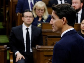 Prime Minister Justin Trudeau, watched by Conservative Leader Pierre Poilievre, delivers remarks in the House of Commons on Parliament Hill in Ottawa on September 15, 2022.