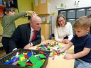 Mahikan Hebeen-Moosewah, left, pranks federal Tourism Minister and Edmonton Centre MP Randy Boissonnault as Families, Children and Social Development Minister Karina Gould met with day care children including Tucker Tomas, right, at Kepler Academy on Tuesday, Jan. 31, 2023, where the governments of Alberta and Canada announced the next step in creating more affordable and accessible childcare spaces in Canada.