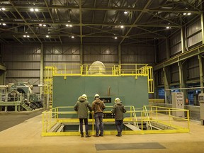 Workers at the huge Sheerness Generating Station south of Hanna, in 2019.