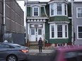 Peggy Cameron, from the non-profit Friends of Halifax Common, stands in front of a stately home that the group is seeking heritage designation to save it from demolition in Halifax on Thursday, January 19, 2023. The home was owned by Dr. Clement Ligoure, the first Black doctor in Nova Scotia, where Dr. Ligoure operated his clinic in the early 1900s--treating hundreds of people injured by the Halifax Explosion on Dec. 6, 1917.