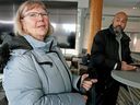 Kathy Ward, left, a senior who lives in Wetaskiwin, and Alberta NDP health critic David Shepherd answer questions at a news conference in Edmonton, Monday, Jan. 30, 2023.  Ward can't find a new family doctor after her family doctor announced he was leaving Alberta.