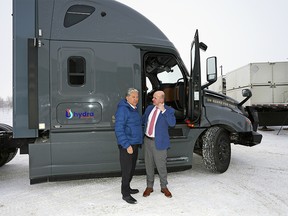 Dan Vandal (left, Minister for PrairiesCan) and Randy Boissonnault (right, Minister of Tourism and Associate Minister of Finance) discuss hydrogen beside a hydrogen diesel fuel truck at the Alberta Motor Transport Association yard near Edmonton, Alberta on Tuesday January 17, 2023, where they outlined federal government support to help Alberta capitalize on economic and environmental opportunities in the rapidly growing hydrogen industry.