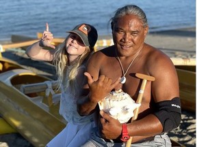 Writer's daughter Brooklyn poses with local guide, Uncle George, post sunrise canoe adventure on the Big Island of Hawaii. Photo, Curt Woodhall