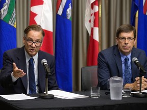 (left to right) Independent MPs Drew Barnes and Todd Loewen speak to the media in Edmonton on Wednesday, August 4, 2021.