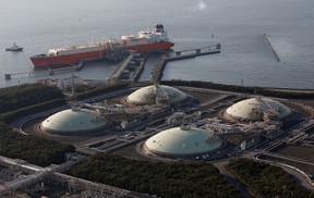 Storage tanks and tanker for liquefied natural gas are seen at the Futtsu Thermal Power Station east of Tokyo on February 20, 2013.