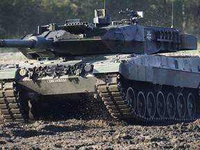 FILE - A Leopard 2 tank is pictured during a demonstration event held for the media by the German Bundeswehr in Munster near Hannover, Germany, Wednesday, Sept. 28, 2011. Poland will apply to the German government for permission to supply the German-made Leopard battle tanks to Ukraine.