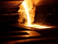 Liquid gold is poured to form gold dore bars at Newmont Mining's Carlin gold mine operation near Elko, Nevada.