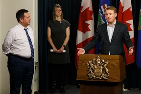 Tyler Shandro speaks at a COVID-19 update on March 25, 2020, with Premier Jason Kenney and chief medical officer of health Dr.  Deena Hinshaw.