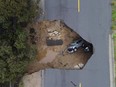 Several people had to be rescued after two vehicles fell into a sinkhole in Chatsworth, California, U.S., January 10, 2023.