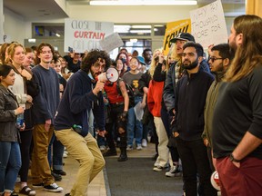 Students protest tuition increases outside the board of governors meeting at the University of Calgary on Friday.