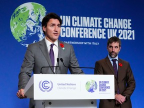 Prime Minister Justin Trudeau and Environment and Climate Change Minister Steven Guilbeault hold a news conference at COP26 in Glasgow, Scotland on Tuesday, Nov. 2, 2021. Albertans must choose who best can counter the plans for decarbonization and the destruction of Alberta's economy, writes Dennis McConaghy.