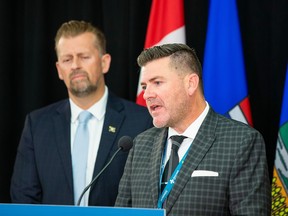 Mike Ellis, then associate minister of mental health and addictions, listens to dr. Robert Tanguay, co-chair of the Alberta Pain Strategy and co-leader of its Rapid Access Addiction Medicine Program on Wednesday, October 5, 2022 in Edmonton.