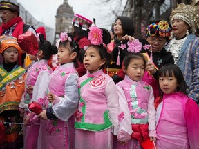 Young girls wait to participate in the Lunar New Year parade, in Vancouver, on Sunday, January 22, 2023.