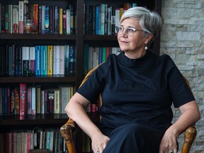 Author Claudia Cattaneo was photographed in her Calgary home on Tuesday, January 31, 2023. 
Gavin Young/Postmedia