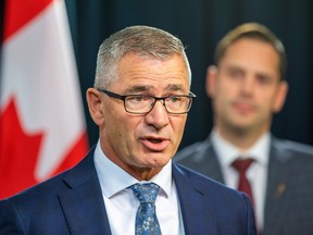 Travis Toews, President of the Treasury Board and Minister of Finance as Matt Jones, Minister of Affordability and Utilities on Wednesday, December 7, 2022 in Edmonton.