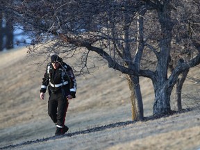 Police conduct a grid search at Deerfoot Athletic Park in northeast Calgary on Thursday, Feb. 16, 2023. Police say the death of a woman found in the park was a homicide.