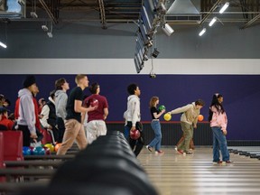 People bowl at YYC Bowling and Entertainment on Thursday, February 23, 2023.