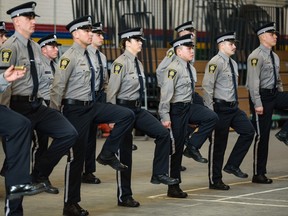 Transit peace officers graduate during a ceremony at Mewata Armory on Friday.