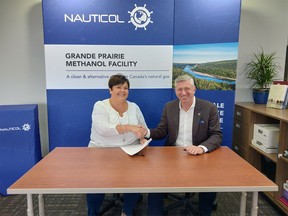 County of Grande Prairie Reeve Leanne Beaupre and Mark Tonner, a director at Nauticol, in a 2017 file photo.