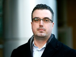 Bryan Morton walks out of the Calgary courts as the corruption trial for three city police officers begins in Calgary on Monday, February 5, 2018.