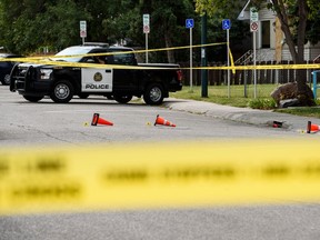 Calgary police at the scene of a shooting that took place at a hookah lounge in the community of Forest Lawn on Saturday, Sept. 12, 2020.