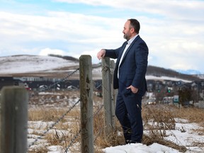 Cary Kienitz, general manager of acquisitions and development for Qualico Communities, takes a look over the land that will be the new community of Southbow Landing in Cochrane.