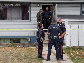 Calgary Police investigate at the scene of a suspicious death inside a house in the 2800 block of 14th Avenue S.E. on Tuesday, October 5, 2021.