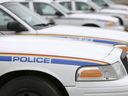 RCMP cruisers line the parking lot at the Airdrie RCMP detachment.