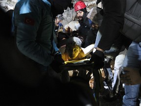 A disabled earthquake victim rescued by local people and rescue volunteers on February 7, 2023 in Elbistan, Turkey.