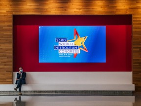 A person waits in the lobby during the 23rd World Petroleum Congress conference at the George R. Brown Convention Center on December 07, 2021 in Houston, Texas.