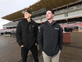 Drivers Robin Larsson (Sweden) and Conner Martell (U.S.) examine the track area at Stampede Park Friday, January 27, 2023.