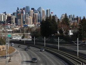 The downtown Calgary skyline is shown east with Bow Trail in the foreground on Thursday, Feb. 16, 2023.