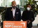 NDP MP David Shepherd, left, and Eyasu Yakob, a research assistant in the University of Alberta's faculty of nursing.  Shepherd said Monday it has been more than 100 days since Smith promised to fix health care within 90 days.
