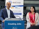 Sam Mathew, founder and CEO of Applexus Technologies, speaks to the media following the announcement that his company has chosen Calgary as its new Canadian headquarters on Wednesday, February 15, 2023. Alberta Minister of Trade, Immigration and Multiculturalism, Rajan Sawhney, listen right.