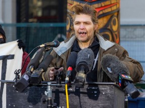 Jason Rondeau speaks at a press conference in Pigeon Park in Vancouver on Feb. 23, 2023.