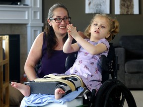 Mom Amanda Levesque and her daughter Ariana, who has a rare condition called GNB1, in Calgary on Sunday, February 26, 2023.