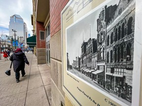 A historic plaque on the Pop Building is seen next to Stephen Avenue Mall in downtown Calgary on Thursday, February 9, 2023. The City of Calgary is looking at new design proposals for the mall. The historical photo of the avenue is around 1907-1908.
