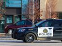 Calgary police guard an office building at 3030 2 Avenue S.E. after an officer-involved shooting early on Tuesday, February 14, 2023.