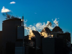 Steam rises from downtown Calgary buildings at sunrise on a cold morning, Tuesday, Nov. 29, 2022.