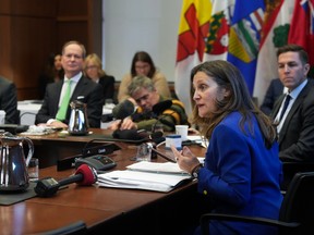 Chrystia Freeland, right, speaks to provincial finance ministers during the Finance Ministers' Meeting in Toronto, on Friday, February 3, 2023.