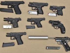 Police say seven of the firearms were smuggled into Canada and the eighth was stolen.
