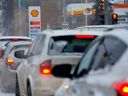 Cars line up outside a Shell gas station in Calgary on Tuesday, Dec. 20, 2022.