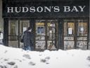 A man walks by Hudson's Bay in Calgary on Wednesday, March 18, 2020.